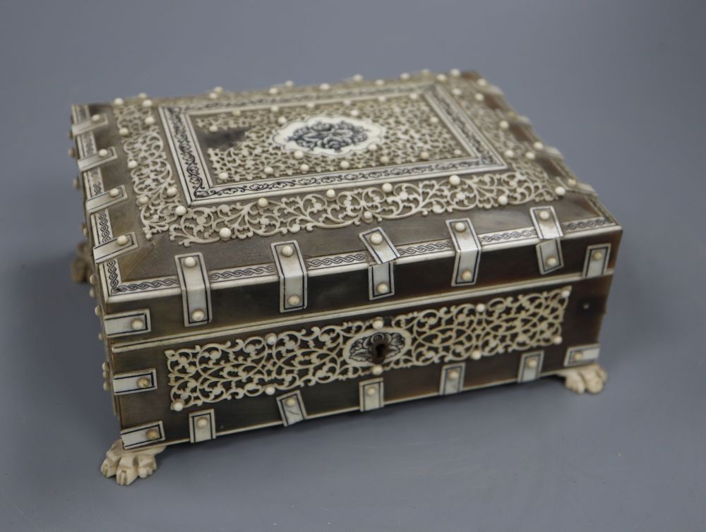 A 19th century Southern Indian horn and ivory mounted trinket box, height 7.5cm and a similar card case